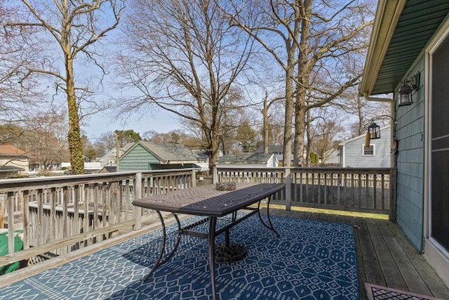 wooden terrace with outdoor dining space
