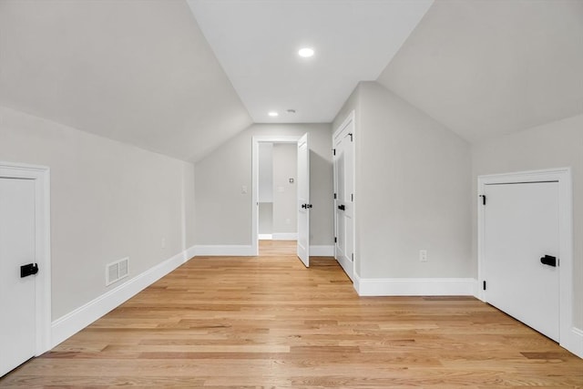 bonus room with light wood finished floors, baseboards, visible vents, lofted ceiling, and recessed lighting