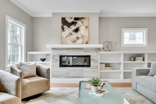 living area featuring plenty of natural light, wood finished floors, and crown molding