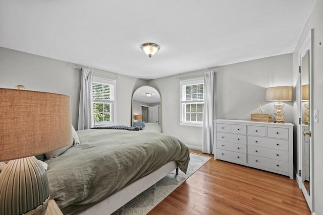 82 Knollwood Dr, Longmeadow, MA 01106 - bedroom with arched walkways and wood finished floors