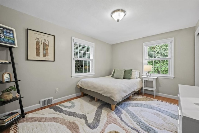 82 Knollwood Dr, Longmeadow, MA 01106 - bedroom featuring multiple windows and wood finished floors