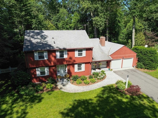 82 Knollwood Dr, Longmeadow, MA 01106 - colonial-style house featuring asphalt driveway, a garage, and a chimney