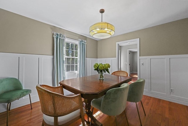 82 Knollwood Dr, Longmeadow, MA 01106 - dining area featuring a decorative wall, a wainscoted wall, and wood finished floors