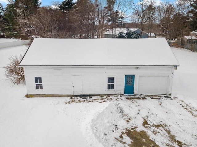 view of snow covered garage