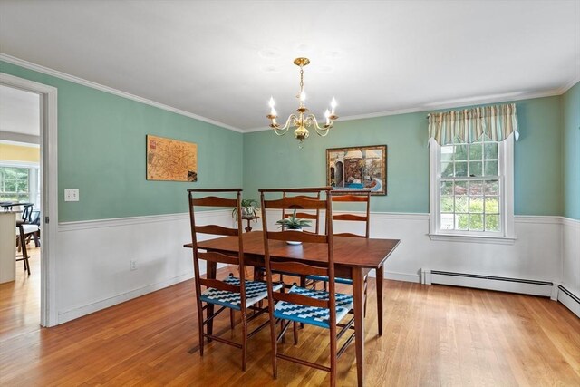 1 Emerson Dr, Acton, MA 01720 - dining area featuring wood finished floors, healthy amount of natural light, a chandelier, and ornamental molding