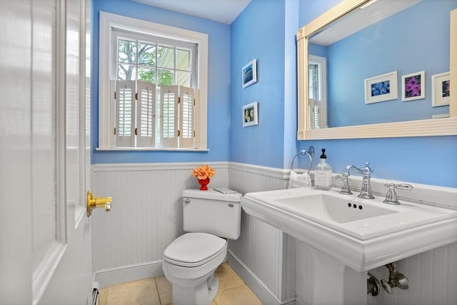 1 Emerson Dr, Acton, MA 01720 - bathroom with toilet, wainscoting, a sink, tile patterned floors, and a baseboard heating unit