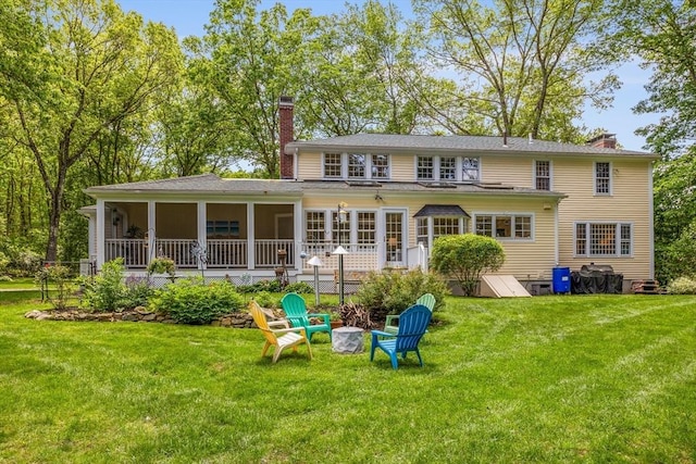 1 Emerson Dr, Acton, MA 01720 - rear view of house featuring a sunroom, a chimney, and a yard
