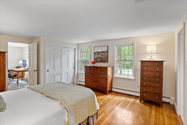 1 Emerson Dr, Acton, MA 01720 - bedroom featuring light wood-type flooring, a closet, a desk, and a baseboard heating unit