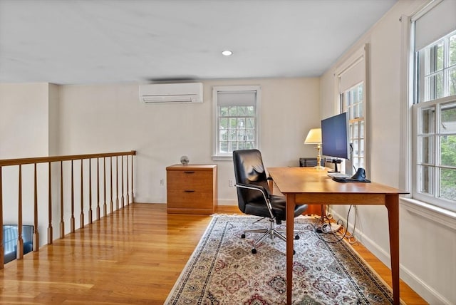 1 Emerson Dr, Acton, MA 01720 - home office with a wall unit AC, plenty of natural light, wood finished floors, and recessed lighting