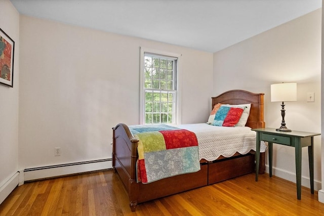 1 Emerson Dr, Acton, MA 01720 - bedroom featuring wood finished floors, a baseboard radiator, and baseboards