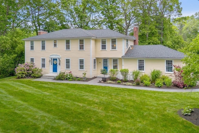 1 Emerson Dr, Acton, MA 01720 - colonial-style house featuring a chimney and a front yard