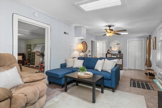 1 Nelson St Unit C, Upton, MA 01568 - living room with light tile patterned flooring, ceiling fan, a skylight, and ornamental molding