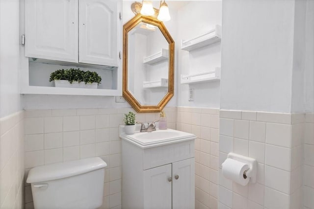 1 Nelson St Unit C, Upton, MA 01568 - half bathroom with tile walls, vanity, and wainscoting