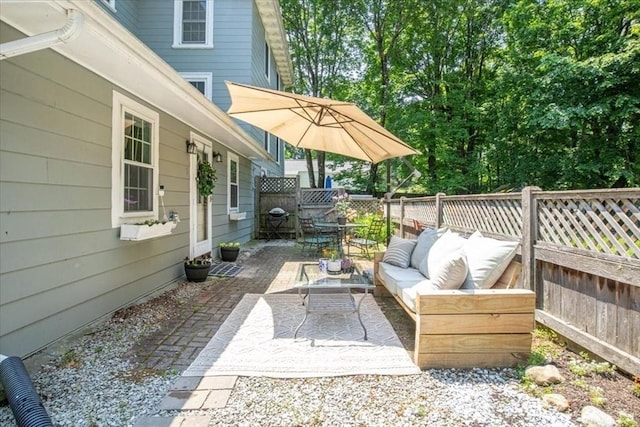 1 Nelson St Unit C, Upton, MA 01568 - fenced backyard featuring an outdoor living space and a patio