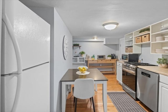 1 Nelson St Unit C, Upton, MA 01568 - kitchen featuring stainless steel appliances, open shelves, light wood-type flooring, and light countertops