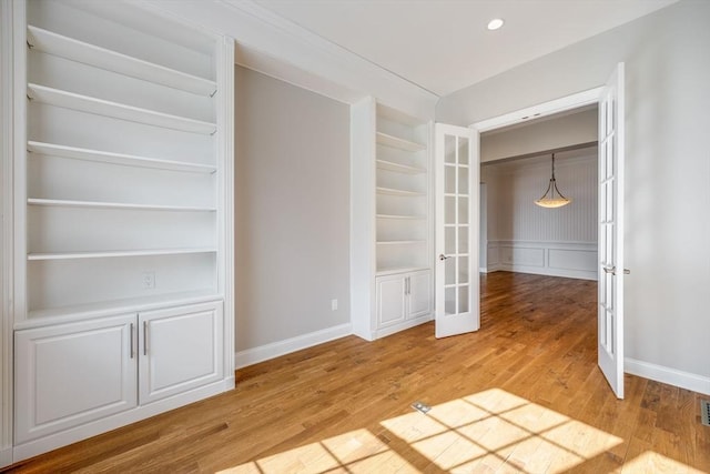 12 Skipping Stone, Plymouth, MA 02360 - unfurnished bedroom with french doors and light wood-style floors