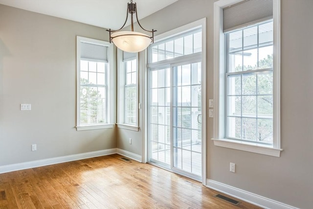 12 Skipping Stone, Plymouth, MA 02360 - unfurnished dining area featuring baseboards and wood finished floors