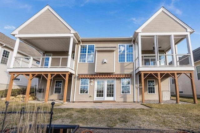 12 Skipping Stone, Plymouth, MA 02360 - back of house featuring a yard, a patio area, ceiling fan, and a balcony