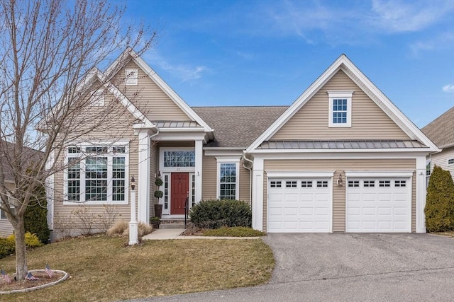 12 Skipping Stone, Plymouth, MA 02360 - view of front of home with a standing seam roof, asphalt driveway, a front yard, and metal roof