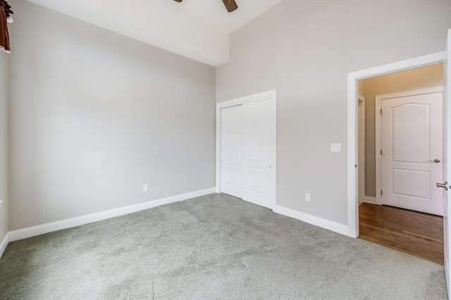 12 Skipping Stone, Plymouth, MA 02360 - unfurnished bedroom featuring carpet, baseboards, a closet, and lofted ceiling