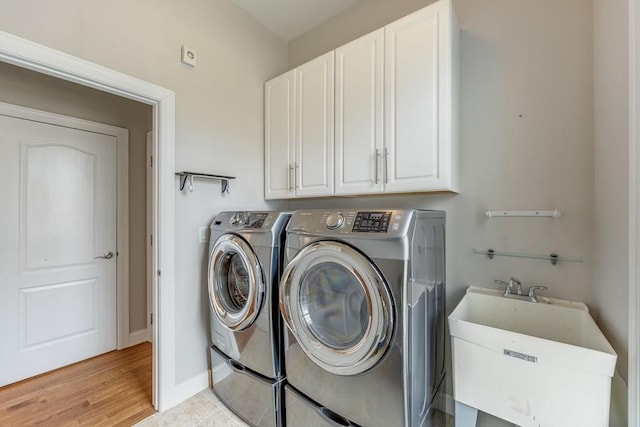 12 Skipping Stone, Plymouth, MA 02360 - washroom with washer and clothes dryer, cabinet space, and baseboards