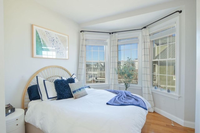 148 Winthrop Shore Dr Unit 5, Winthrop, MA 02152 - bedroom featuring multiple windows and wood finished floors