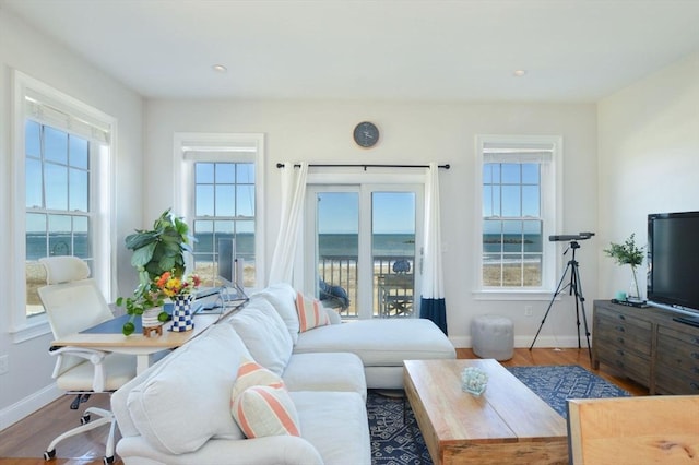 148 Winthrop Shore Dr Unit 5, Winthrop, MA 02152 - living room with wood finished floors, recessed lighting, and a water view