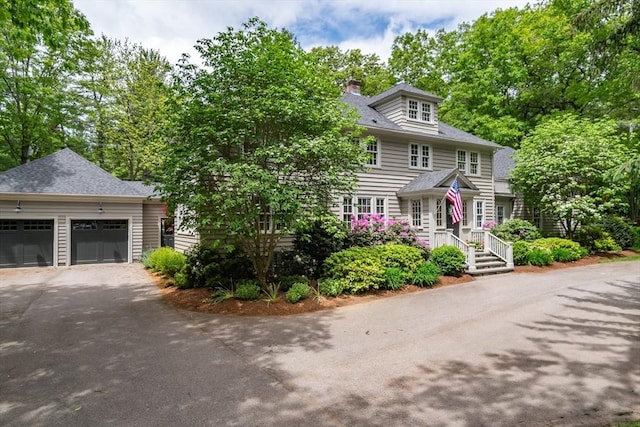 617 S St, Needham, MA 02492 - view of front of home with driveway and a chimney