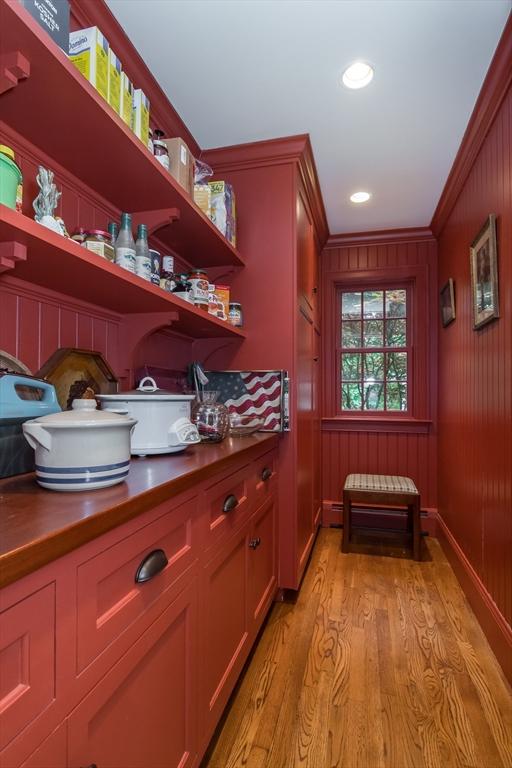 617 S St, Needham, MA 02492 - bar featuring light wood-style flooring, ornamental molding, and recessed lighting