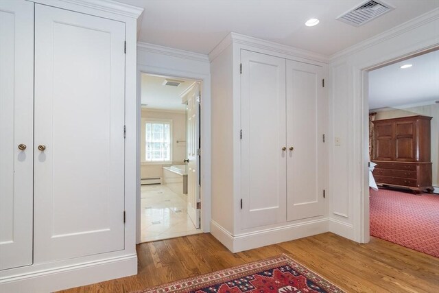 617 S St, Needham, MA 02492 - closet featuring a baseboard radiator