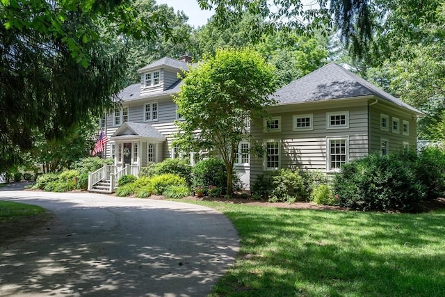 617 S St, Needham, MA 02492 - view of front of home featuring a front yard and a chimney
