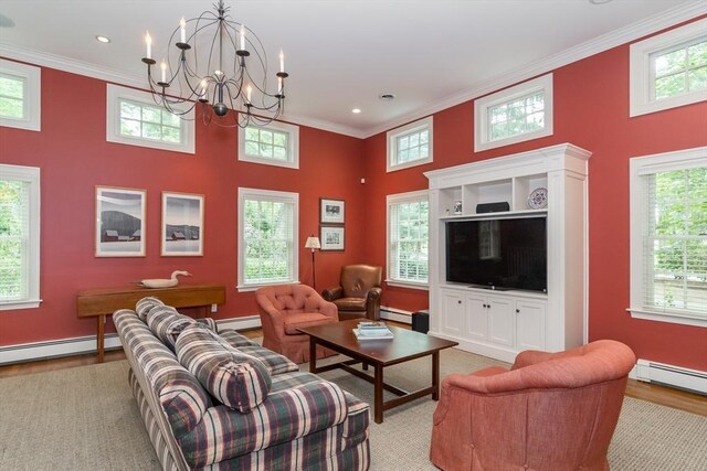 617 S St, Needham, MA 02492 - living room with a baseboard radiator, ornamental molding, a chandelier, light wood-style floors, and a towering ceiling