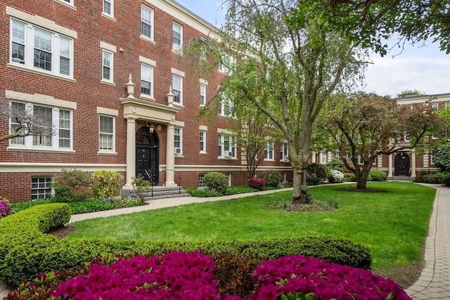 59 Babcock St Unit 5, Brookline, MA 02446 - view of front of property featuring brick siding and a front lawn
