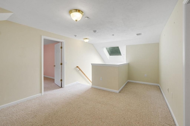 15 Pebble Bch Unit 2005-103, Mashpee, MA 02649 - carpeted empty room featuring vaulted ceiling and baseboards
