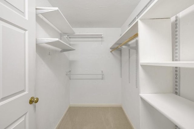 15 Pebble Bch Unit 2005-103, Mashpee, MA 02649 - walk in closet featuring carpet