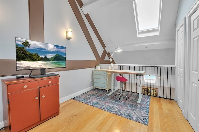 28 Broad St Unit 203, Marlborough, MA 01752 - home office featuring a skylight, wood finished floors, and vaulted ceiling