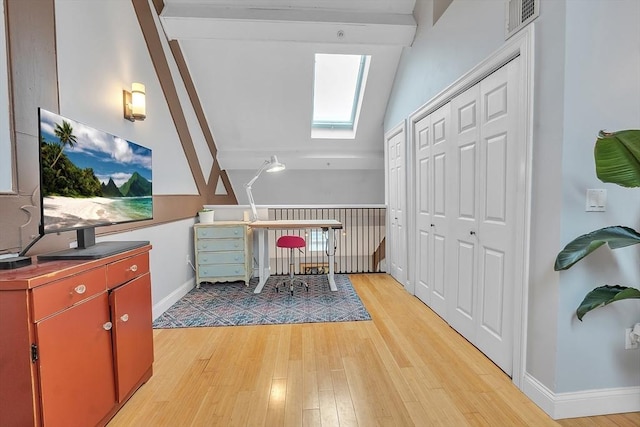 28 Broad St Unit 203, Marlborough, MA 01752 - bedroom featuring a skylight, light wood-style flooring, and a closet