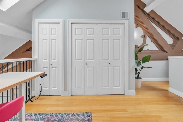 28 Broad St Unit 203, Marlborough, MA 01752 - interior space featuring wood finished floors, a skylight, and vaulted ceiling