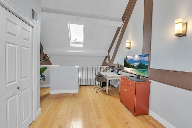 28 Broad St Unit 203, Marlborough, MA 01752 - home office featuring a skylight, beam ceiling, and light wood-style floors
