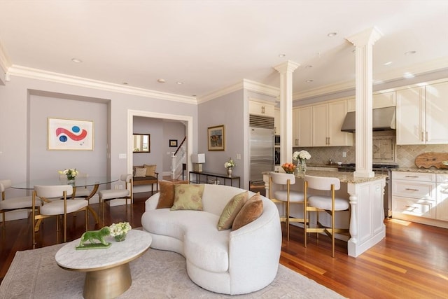 392 Marlborough St Unit 3, Boston, MA 02115 - living area featuring ornate columns, stairs, crown molding, light wood-type flooring, and recessed lighting