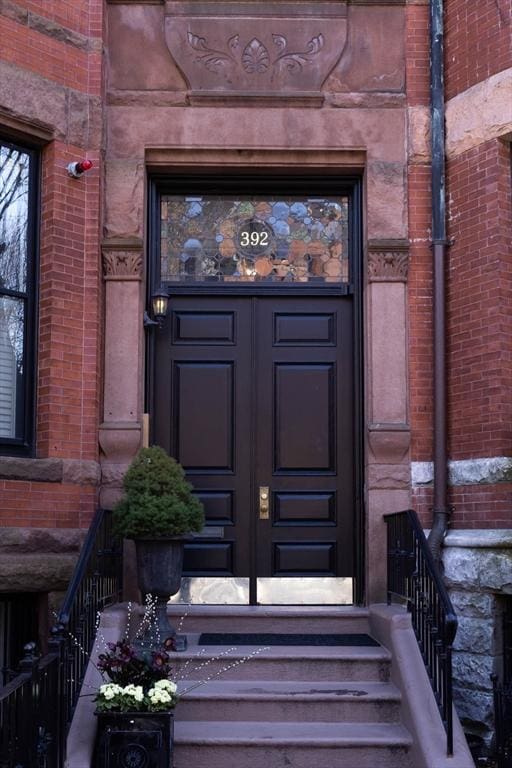 392 Marlborough St Unit 3, Boston, MA 02115 - doorway to property with brick siding and french doors