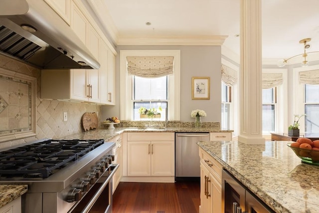 392 Marlborough St Unit 3, Boston, MA 02115 - kitchen with stainless steel appliances, crown molding, dark wood-style flooring, light stone countertops, and under cabinet range hood