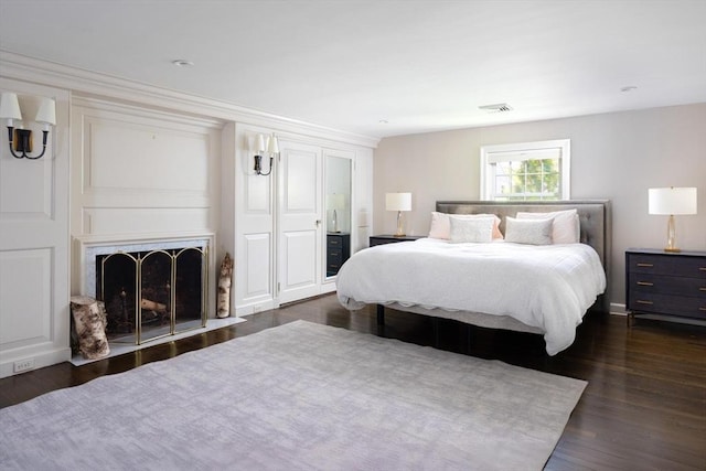 86 Waban Ave, Newton, MA 02468 - bedroom featuring wood finished floors and a fireplace with flush hearth