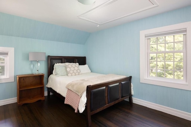 86 Waban Ave, Newton, MA 02468 - bedroom featuring attic access, dark wood finished floors, multiple windows, and vaulted ceiling