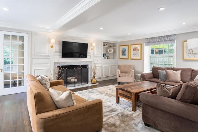 86 Waban Ave, Newton, MA 02468 - living area with a high end fireplace, wood finished floors, ornamental molding, and recessed lighting