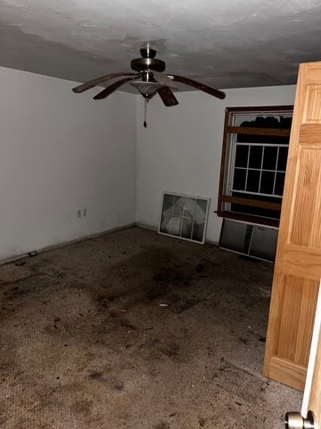 unfurnished living room featuring ceiling fan