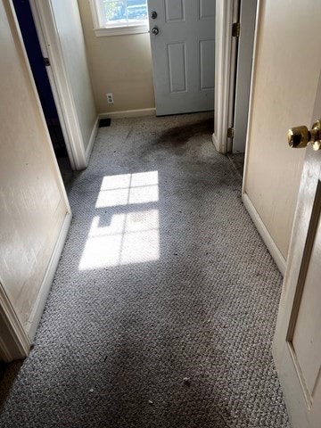 unfurnished room with light colored carpet