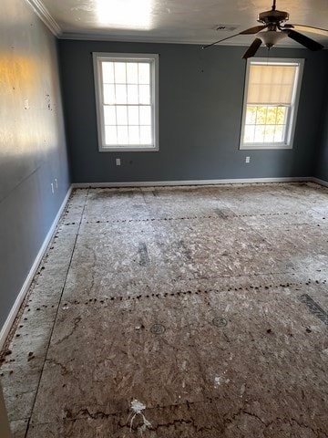 spare room featuring crown molding and ceiling fan