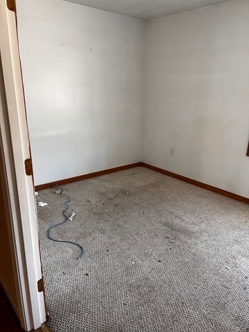 unfurnished room featuring carpet flooring