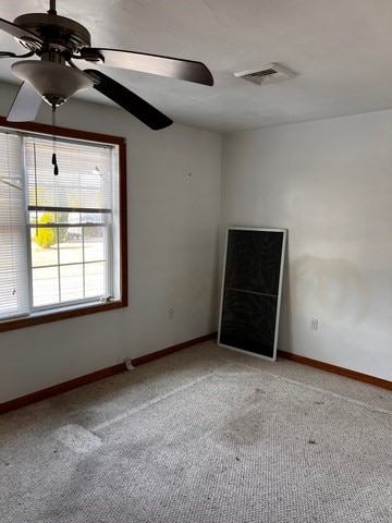 carpeted empty room with ceiling fan